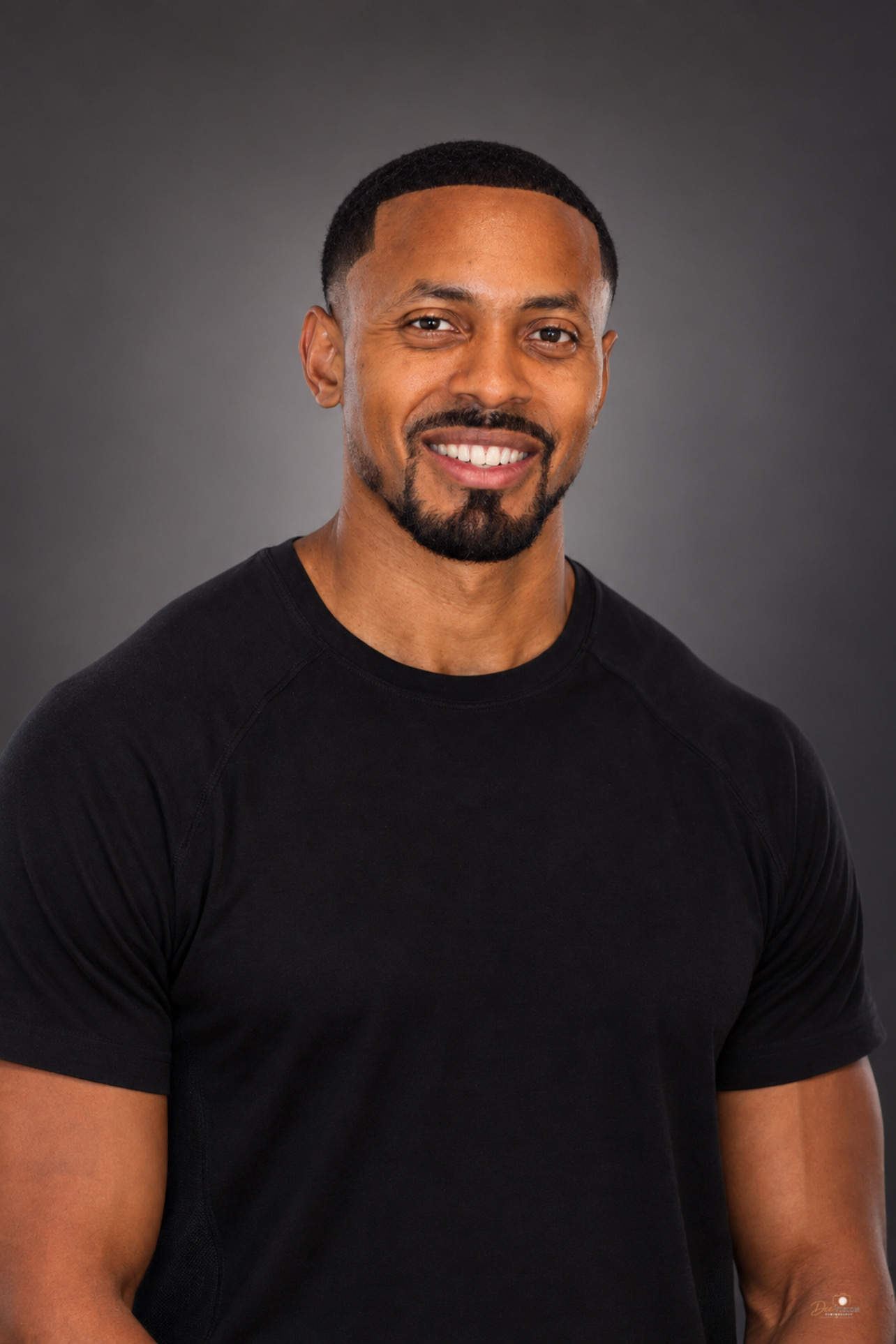 Head-and-shoulders portrait of Marlon Smith in a black shirt